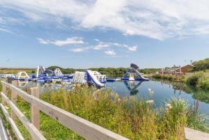 a view of a river with boats in the water at 6 Bed in Winnards Perch oc-t29966 in Saint Columb Major