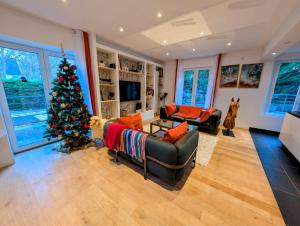 a living room with a christmas tree in it at Maison de la Vicomté in Dinard