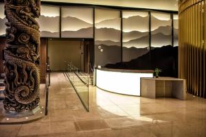 a lobby with a building with mountains on the windows at Hotel Fusion, a C-Two Hotel in San Francisco