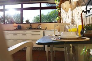 a kitchen with a table with a plate of food on it at Quinta Ivonne in Montemor-o-Velho