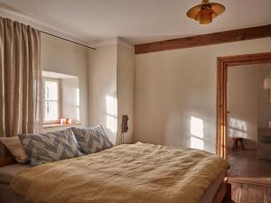 a bedroom with a bed and a window at Denharten in Tann +18 photos