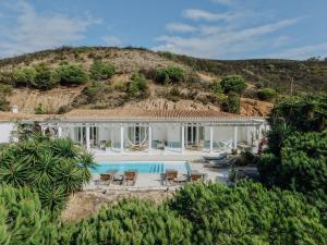 an aerial view of a house with a swimming pool at Herdade d'Amoreira Jasmin Villa in Aljezur