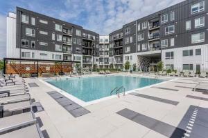 an apartment complex with a swimming pool and buildings at Cincinnati Downtown Oasis in Cincinnati