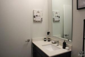 a bathroom with a sink and a mirror at Cincinnati Downtown Oasis in Cincinnati +15 photos