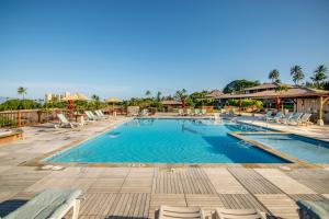 a pool at a resort with lounge chairs at Kaanapali Maui at the Eldorado by OUTRIGGER - Select Your Unit in Lahaina