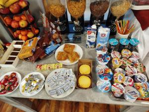 a table topped with lots of different types of food at Ferien Wohnung in Chemnitz +6 photos