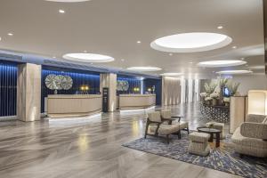 a lobby of a hotel with chairs and a waiting room at Hilton Istanbul Bosphorus in Istanbul