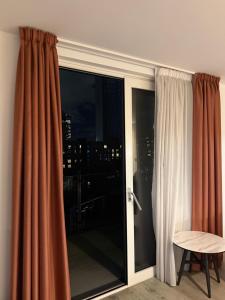 a room with a sliding glass door with a window at Chalk in Moffat