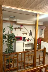 a kitchen with a table and a counter top at Rodinný penzion Míša in Velká Úpa +21 photos