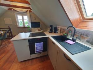a kitchen with a sink and a counter top at Santa Maria in Ferdinandshof