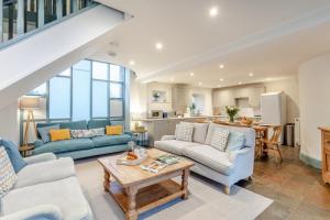 a living room with two couches and a table at 4 Bed in Shebbear oc-w33730 in Black Torrington