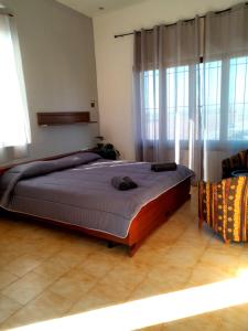 a bedroom with a large bed in a room at Seven B&b in Casalmorano