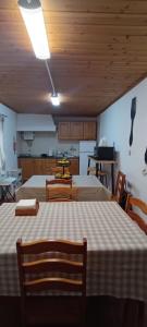 a large room with two beds and a kitchen at Jomafreitas in Ponta Delgada