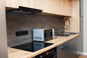 a microwave sitting on a counter in a kitchen at Dili Hill in Dilijan