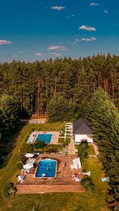 an aerial view of a resort with a swimming pool at Pensjonat Uroczysko Zaborek in Janów Podlaski