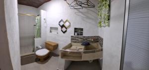 a bathroom with a tub and a toilet and a sink at Hospedaje Luz d' Luna in Puerto Triunfo +93 photos