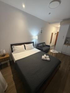 a bedroom with a large bed with a black blanket at HS Beach in Torrevieja