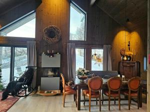 a dining room with a table and chairs at Mountain Cabin With Panoramic Views And Sauna in Oppdal