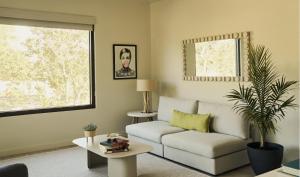 a living room with a couch and a table at Hotel Circulo in Charleston