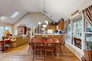 a kitchen and living room with a table and chairs at Lakeledge Hideaway in Beech Mountain