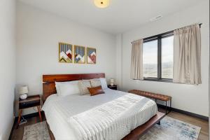 a bedroom with a large bed and a window at The 19th Hole in Sturgis