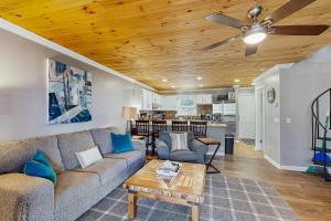 a living room with a couch and a ceiling fan at Cloud Nine Mountain Home in Sugar Mountain