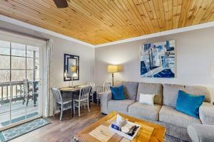 a living room with a couch and a table at Cloud Nine Mountain Home in Sugar Mountain +9 photos