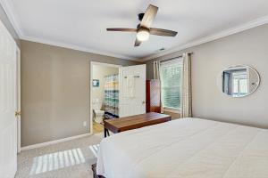 a bedroom with a bed and a ceiling fan at Cloud Nine Mountain Home in Sugar Mountain
