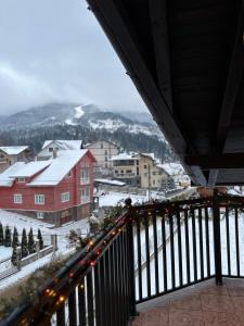 a view from a balcony of a town with snow at Sky Borsa in Statjunea Borsa