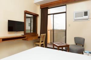 TV a/nebo společenská místnost v ubytování Tsai Hotel and Residences