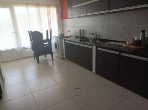 a kitchen with a table and a chair in it at Casa en Ataliva Roca in Ataliva Roca