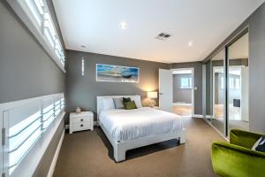 a bedroom with a white bed and a window at Il Mare' in Albany