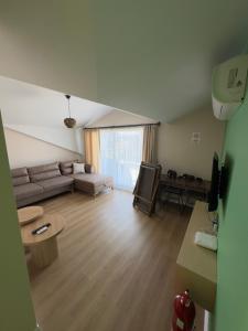 a living room with a couch and a table at InOut Social in Fethiye