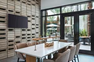 a conference room with a white table and chairs at AC Hotel by Marriott Phoenix North Norterra in Phoenix