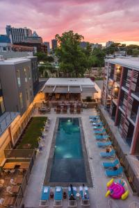 an overhead view of a pool on top of a building at The Cabins at East Austin Hotel in Austin