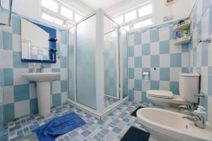 a bathroom with a toilet and a sink and a shower at Bella Guesthouse Charming Beachfront Stay in Blue Bay +82 photos