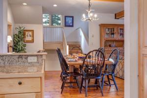 a dining room with a wooden table and chairs at Abode at Moose Creek #21 in Teton Village