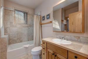 a bathroom with a sink and a toilet and a shower at Abode at Moose Creek #21 in Teton Village +65 photos