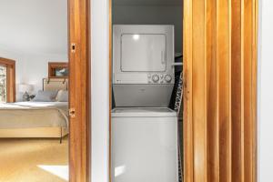 a tv sitting on top of a refrigerator in a room at Abode at Sundance in Teton Village