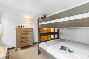 a bedroom with a bunk bed and a dresser at Abode at Sundance in Teton Village