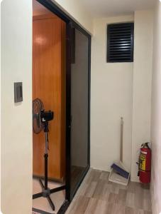 a glass door with a camera in a room at Studio Apartment in Mactan, Cebu Room304 in Lapu Lapu City