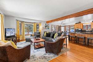 a living room with a couch and a table at Abode at Fish Creek in Wilson