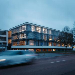 a building with a car in front of it at Designer Loft am Dessauer Hauptbahnhof in Dessau