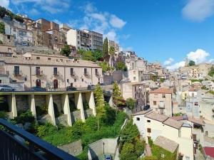 a view of a city with buildings and a bridge at CASA DIDYMA in San Giovanni Gemini