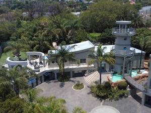 an aerial view of a house with a lighthouse at Silva Villa in Bedfordview