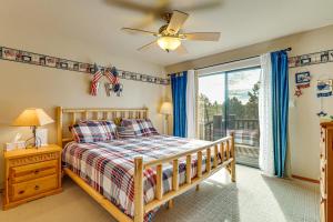 a bedroom with a bed and a ceiling fan at Hike, Fish & Enjoy Pond On-Site: Bison Ranch Cabin in Overgaard