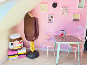 a childs play room with a table and chairs at Candypartment Sweets 'n Sleep in Gelsenkirchen