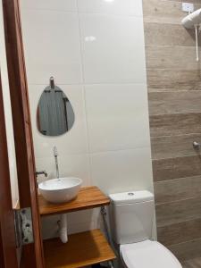 a bathroom with a sink and a toilet at Pousada Paracuru Surf in Paracuru +85 photos