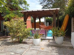 a backyard with a swing set and a playground at Casa com spa hidromassagem in Florianópolis