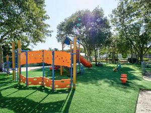 a playground with an orange slide in a park at Tiki Cabana at Key Largo in Key Largo